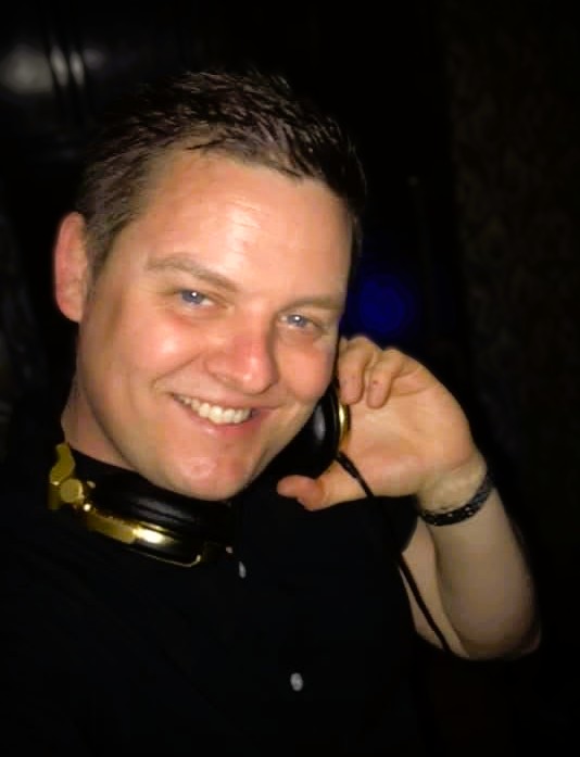 DJ Mikey Gee at his deck at a party in Essex